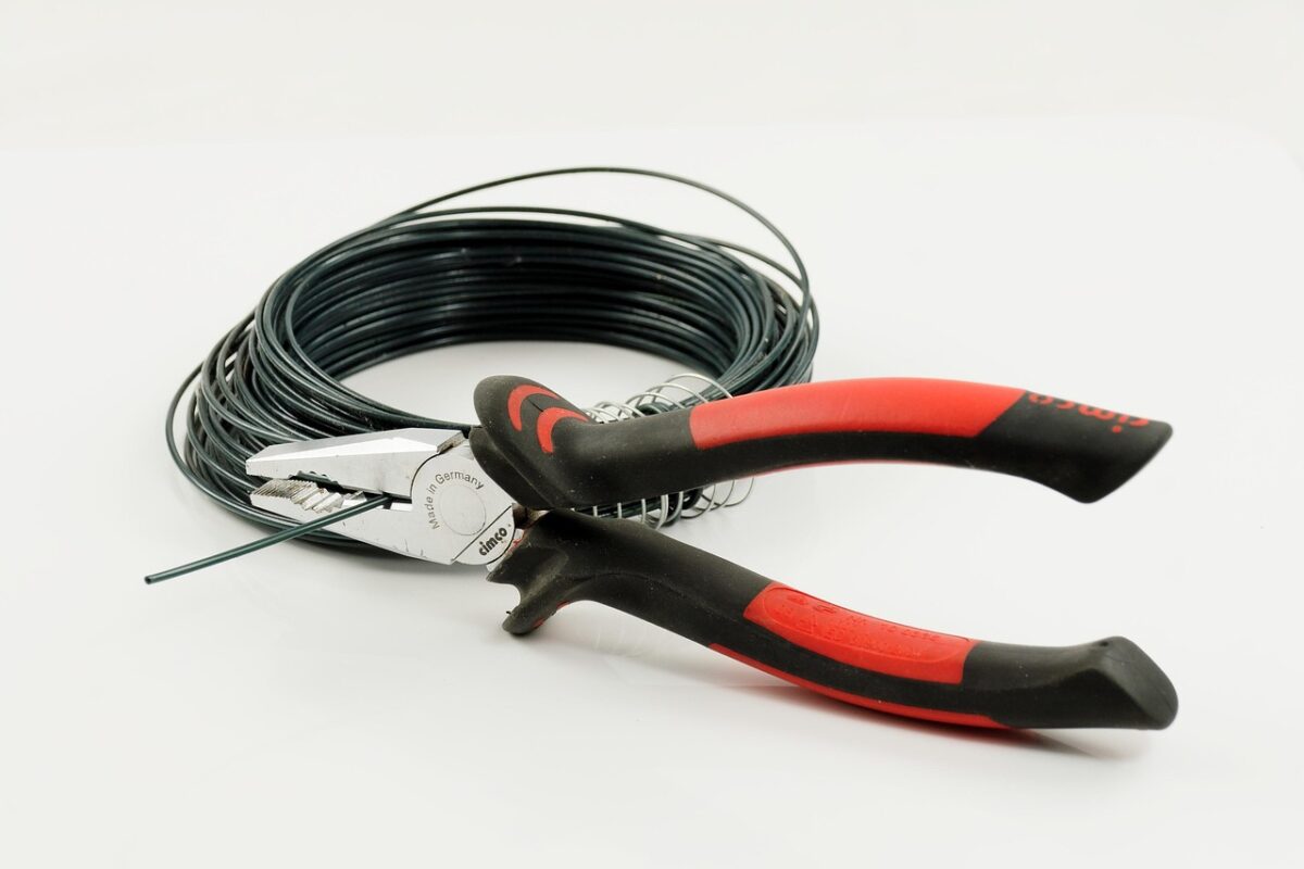 Wire strippers and crimping tool on a bench
